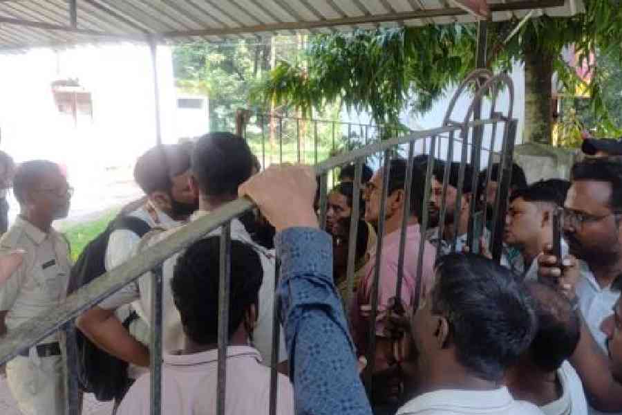 The duped customers protest outside the bank in Farakka on Friday