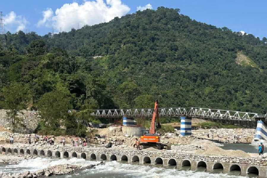 The diversion road under construction over the Balason river at Dudhia