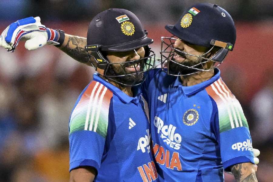 Virat Kohli and Rohit Sharma during their unbroken168-run stand in Sydney on Saturday.