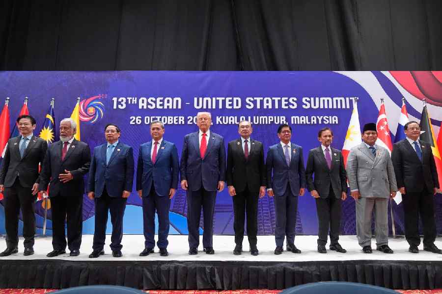 President Donald Trump poses for a family photo with, from left, Singapore Prime Minister Lawrence Wong, East Timor's Prime Minister Kay Rala Xanana Gusmao, Vietnam's Prime Minister Pham Minh Chinh, Cambodian Prime Minister Hun Manet, Malaysian Prime Minister Anwar Ibrahim, Philippine President Ferdinand Marcos Jr., the Sultan of Brunei Hassanal Bolkiah, Indonesian President Prabowo Subianto and Laos' Prime Minister Sonexay Siphandone at the ASEAN Summit in Kuala Lumpur, Malaysia, Sunday, Oct. 26, 2025.