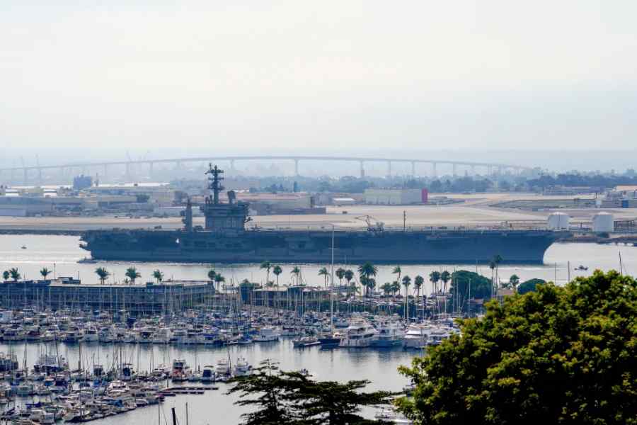 The USS Nimitz (CVN 68) departs San Diego Bay, Aug. 19, 2023, at Mission Beach, in San Diego.
