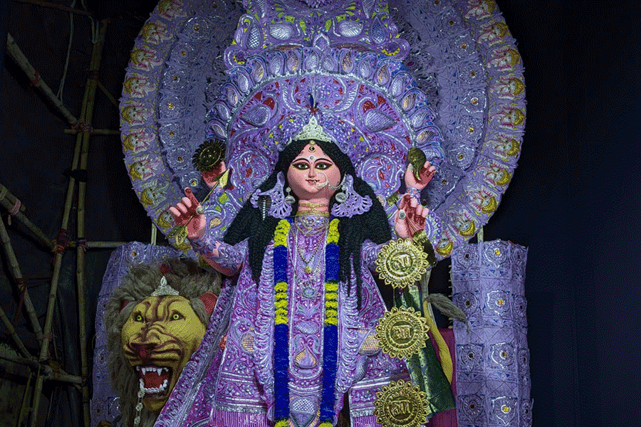 An idol of Maa Jagadhatri, resplendent in shades of lavender and silver