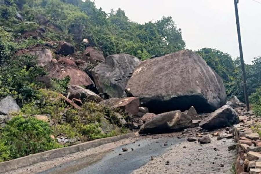 A boulder blocks a road after a landslide in the Anagha gram panchayat of Odisha’s Gajapati district on Tuesday.