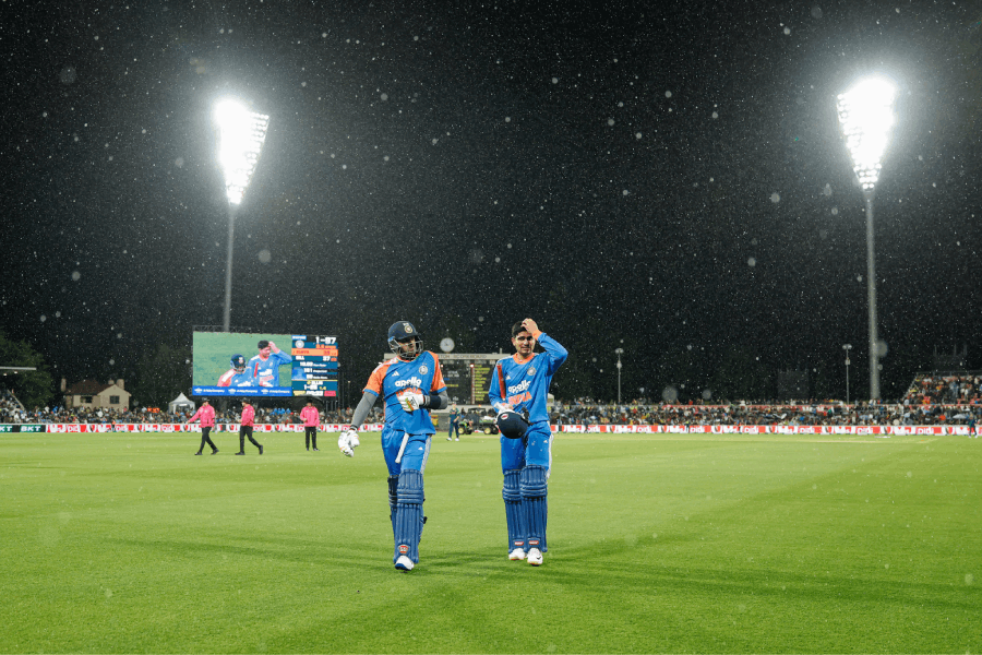 India's T20I captain Suryakumar Yadav and Shubman Gill walk out after rain interrupted their innings against Australia.