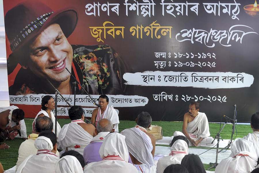 People take part in "Naam Prasanga", a devotional service or ritual, to pay tribute to late music icon Zubeen Garg, in Guwahati, Tuesday, Oct. 28, 2025.
