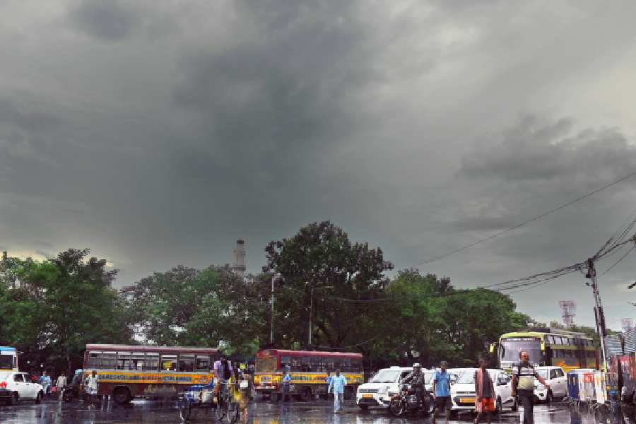 Commuters amid showers in Esplanade on Wednesday afternoon.