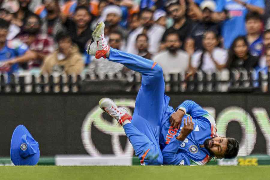 India's Shreyas Iyer reacts after sustaining an injury while taking the catch of Australia's Alex Carey during the third ODI cricket match between India and Australia, in Sydney, Saturday, Oct. 25, 2025.