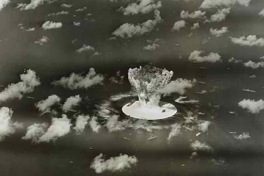 A mushroom cloud rises with ships below during Operation Crossroads nuclear weapons test on Bikini Atoll, Marshall Islands in this 1946 handout provided by the U.S. Library of Congress.