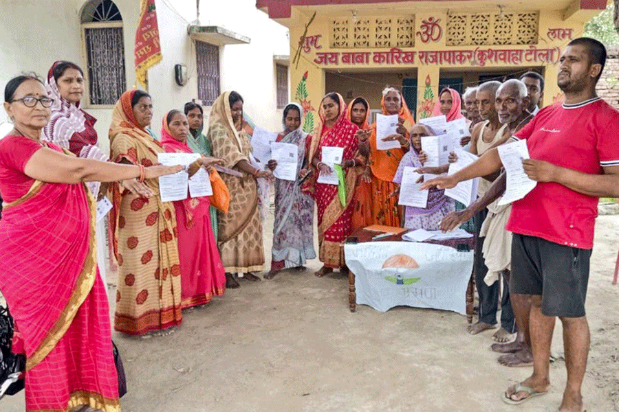 Voters in Vaishali district show the enumeration forms given by a booth level officer (BLO) on July 4 this year during the special intensive revision of electoral rolls in Bihar.