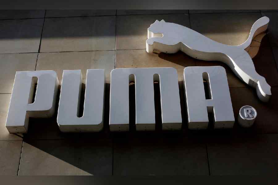 The logo of German sports goods firm Puma is seen at the entrance of one of its stores in Vienna, Austria, March 18, 2016.