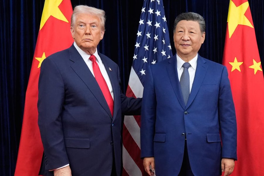 President Donald Trump, left, and Chinese President Xi Jinping pose ahead of their summit talk at Gimhae International Airport in Busan, South Korea, Thursday, Oct. 30, 2025.