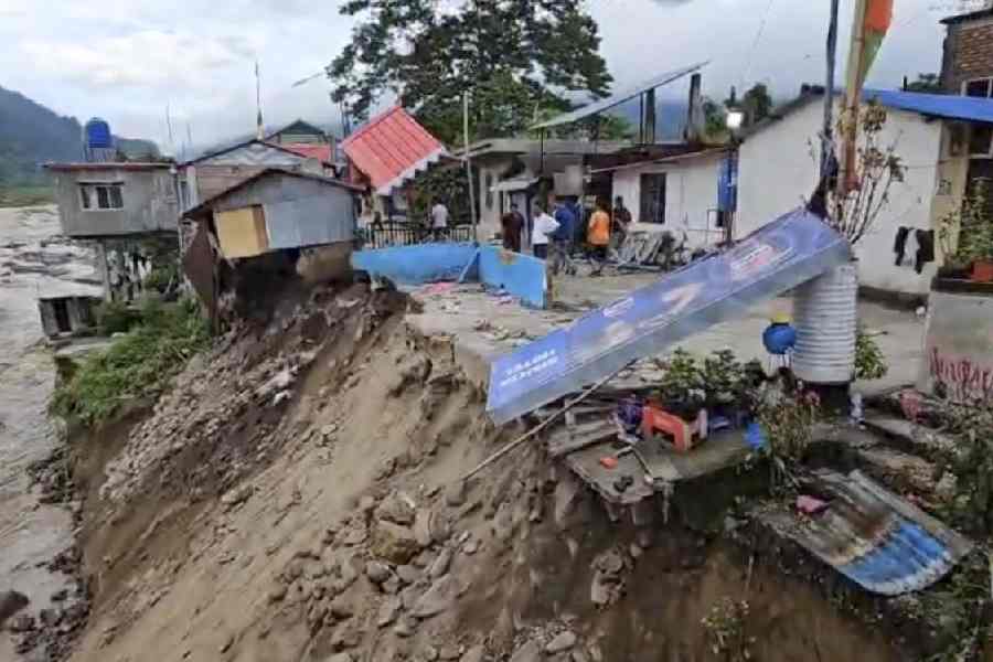 Damaged remains of houses, holdings, and other items scattered around in a disaster-hit area, in Darjeeling