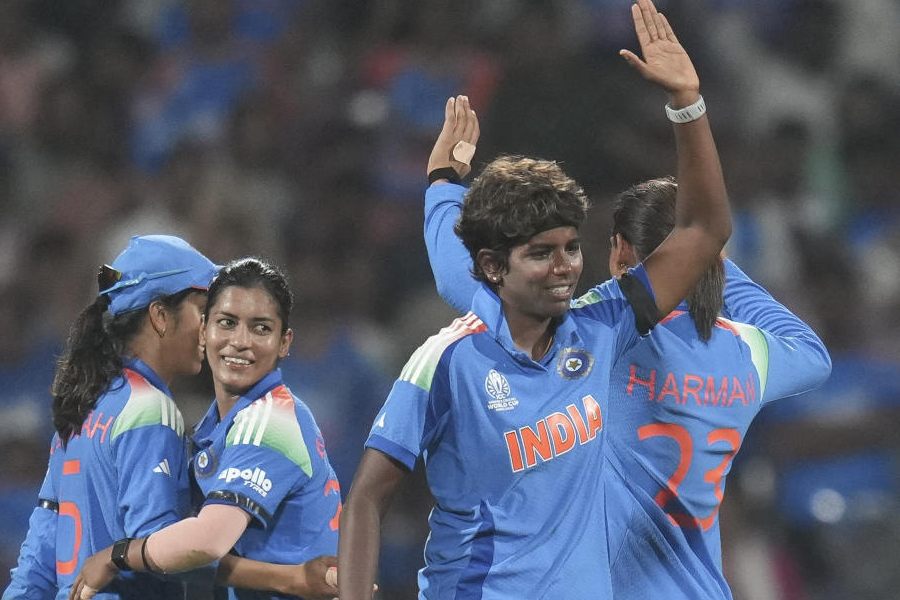 India's players celebrate a wicket during an ICC Women's World Cup semifinal ODI cricket match between India Women and Australia Women, at the DY Patil Stadium, in Navi Mumbai, Thursday, Oct. 30, 2025.