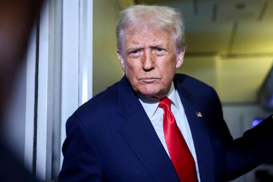 Donald Trump speaks to the media on board Air Force One on Thursday.