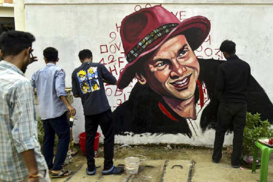 Artists paint a mural of Zubeen Garg in Guwahati.
