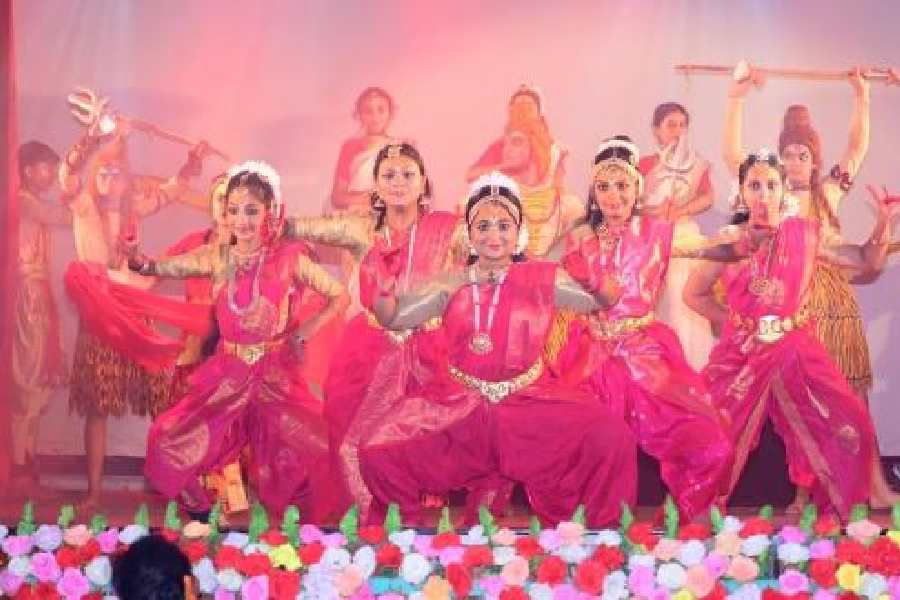 Students strike a dance pose