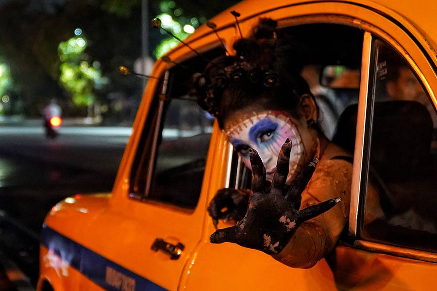 With elaborate costumes, painted faces and glowing props, this year’s celebration drew large crowds of onlookers and photographers