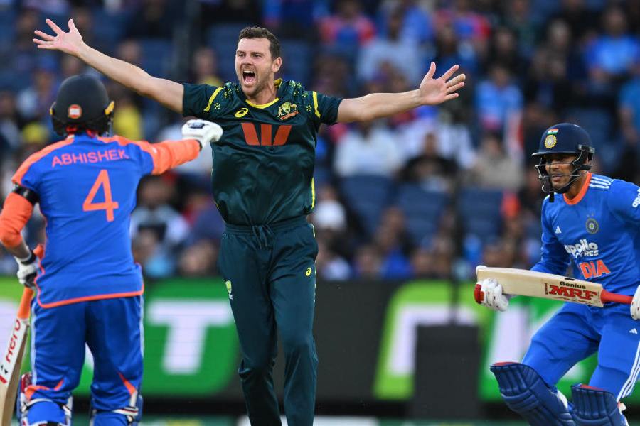 Australia's Josh Hazlewood, center, appeals unsuccessfully for the wicket of India's Shubman Gill, right, during their T20 cricket match in Melbourne, Australia, Friday, Oct. 31, 2025.