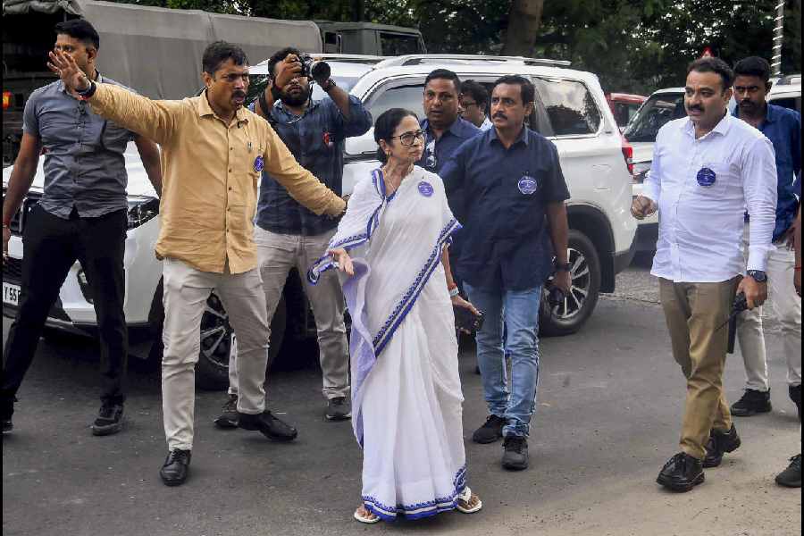 Mamata Banerjee arrives after army personnel allegedly dismantled Trinamool’s stage erected beside the Gandhi statue in the Maidan area on Monday.