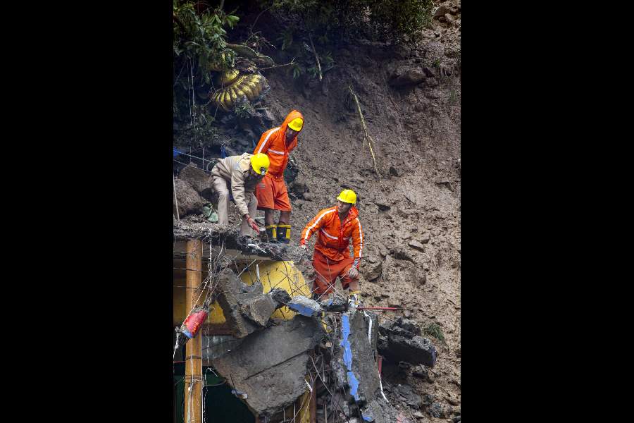 NDRF personnel during a search operation in Kullu on Wednesday.