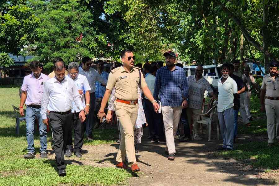 Police and administrative officials, along with members of the Jalpaiguri municipality, visit the ABPC Ground in the town on Wednesday. The chief minister is scheduled to attend the public service distribution programme on the ground.
