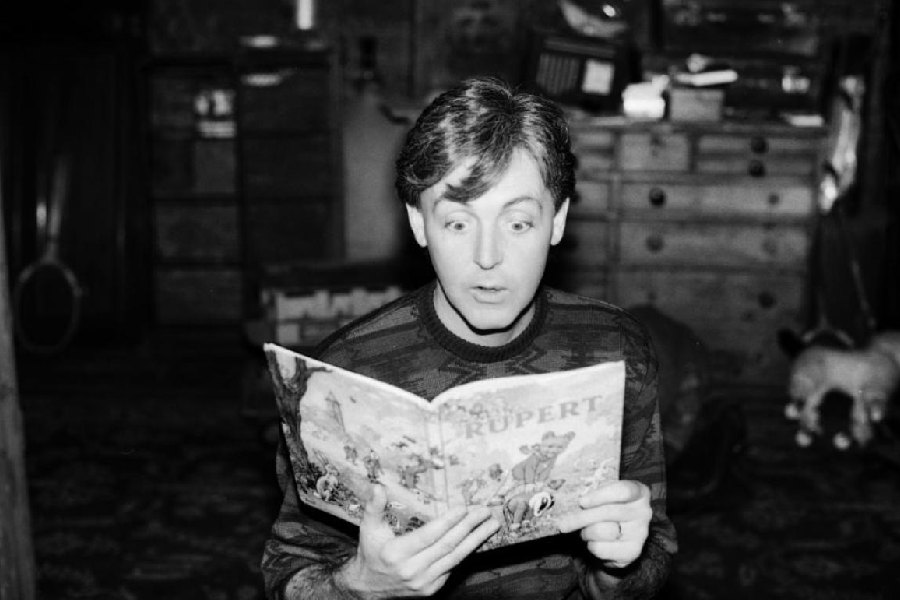 File picture of Paul McCartney reading a Rupert Bear comic book