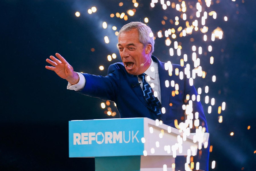 Britain's Reform UK party leader Nigel Farage gestures as he attends the party's national conference at the National Exhibition Centre in Birmingham, Britain, September 5, 2025.