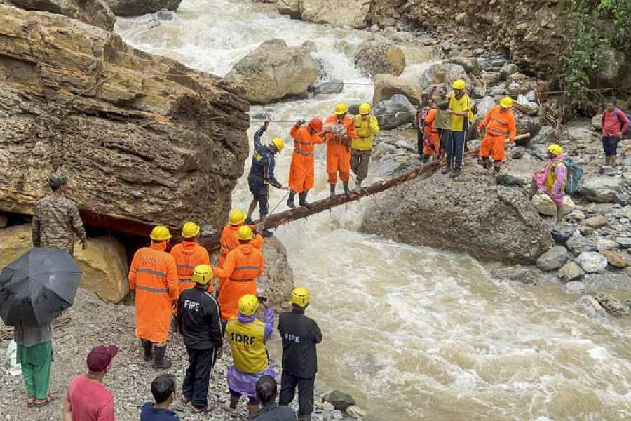 NDRF and SDRF personnel conduct a search and rescue operation at an affected area after a cloudburst, at Pausari village in Bageshwar district, Uttarakhand, Monday, Sept. 1, 2025.