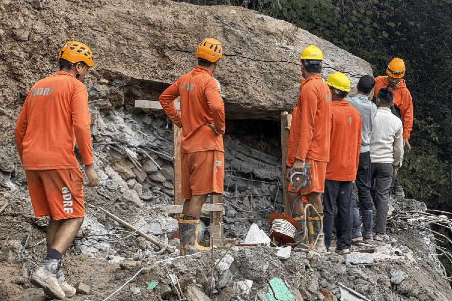 NDRF personnel conduct a search and rescue operation at a landslide-hit area, in Akhara Bazaar, Kullu district, Himachal Pradesh, Saturday, Sept. 6, 2025.