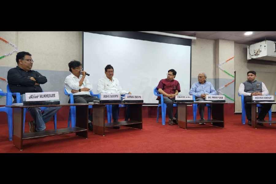 Arun Kumar Dasgupta makes a point at a panel discussion as (from left) Jaydip Mukherjee, Amitabha Sengupta, Debashis Sen, Prodip Kumar Deb and Angshuman Choudhury listen