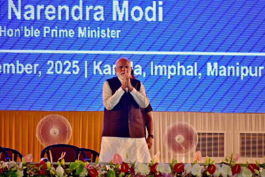 Narendra Modi greets supporters upon his arrival at a public meeting in Imphal, in the northeastern state of Manipur, India, September 13, 2025.