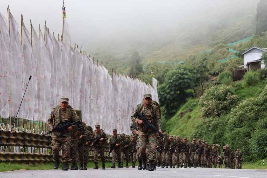 Army personnel cross a high-altitude terrain in Sikkim