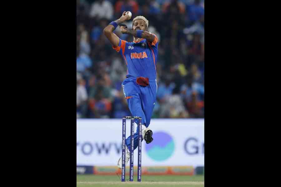 India's Hardik Pandya bowls a delivery during the Asia Cup 2025 cricket match between India and Oman, in Dubai.