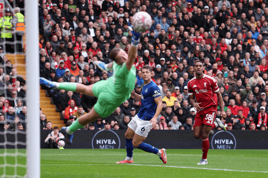 Liverpool's Ryan Gravenberch scores their first goal past Everton's Jordan Pickford.