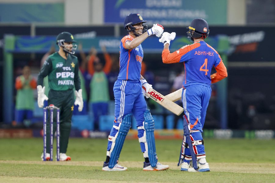 Abhishek Sharma (right) being congratulated by teammate Shubman Gill after his half century during the Asia Cup 2025 Super Four match between India and Pakistan, in Dubai, UAE.