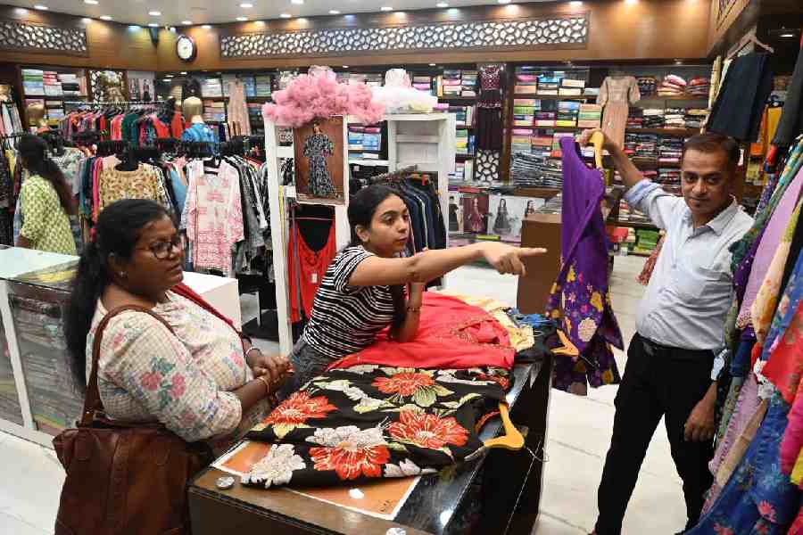 Shoppers at New Market during Puja shopping on Sunday, September 14, 2025.
