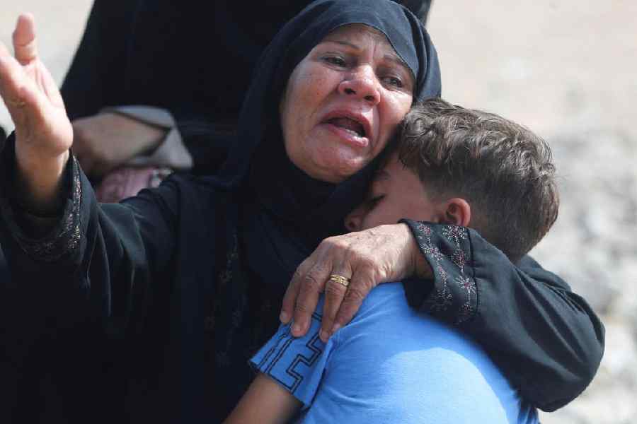 A mourner reacts during the funeral of Palestinians killed in Israeli fire, according to medics, at Al-Shifa hospital, in Gaza City