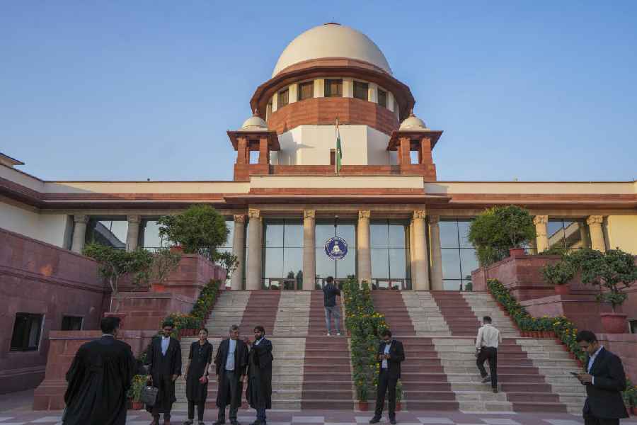 Lawyers at the Supreme Court complex, in New Delhi, Monday, Oct. 14, 2024
