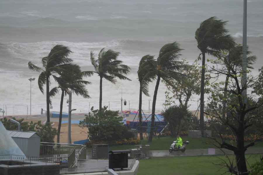 A security person patrols along a beach in Shenzhen in southern China's Guangdong province on Wednesday, Sept. 24, 2025.