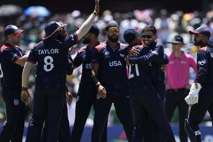 United States' Nitish Kumar, third right, celebrates with teammates after taking the catch to dismiss Pakistan's Iftikhar Ahmed in super over during the ICC Men's T20 World Cup cricket match between United States and Pakistan at the Grand Prairie Stadium in Grand Prairie, Texas, Thursday, June 6, 2024.