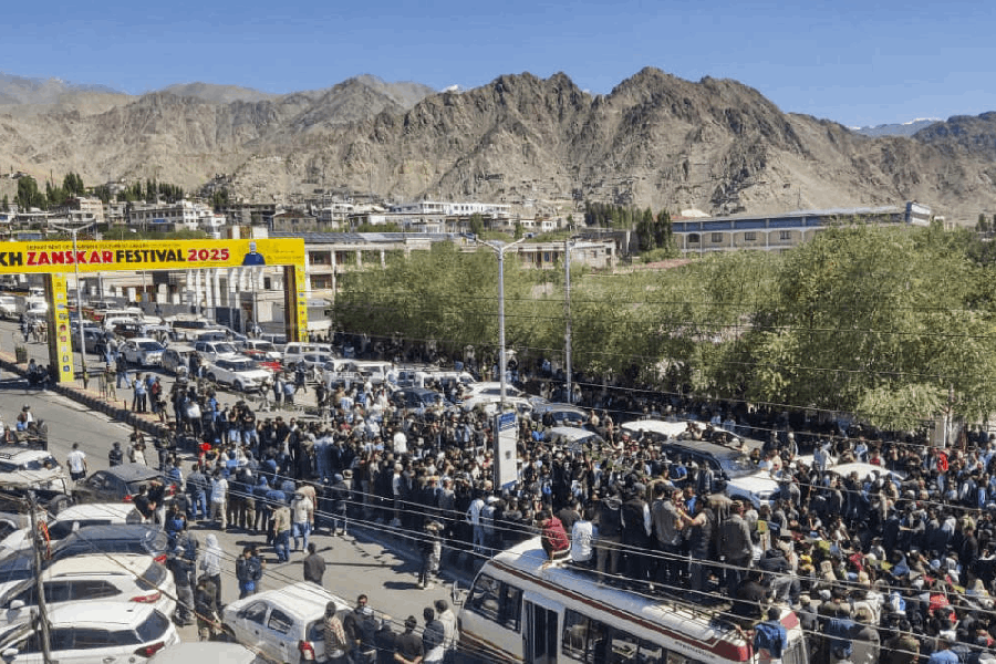 People block a road during a protest demanding statehood for Ladakh and its inclusion under the Sixth Schedule, in Leh, Ladakh, Wednesday, Sept. 24, 2025.