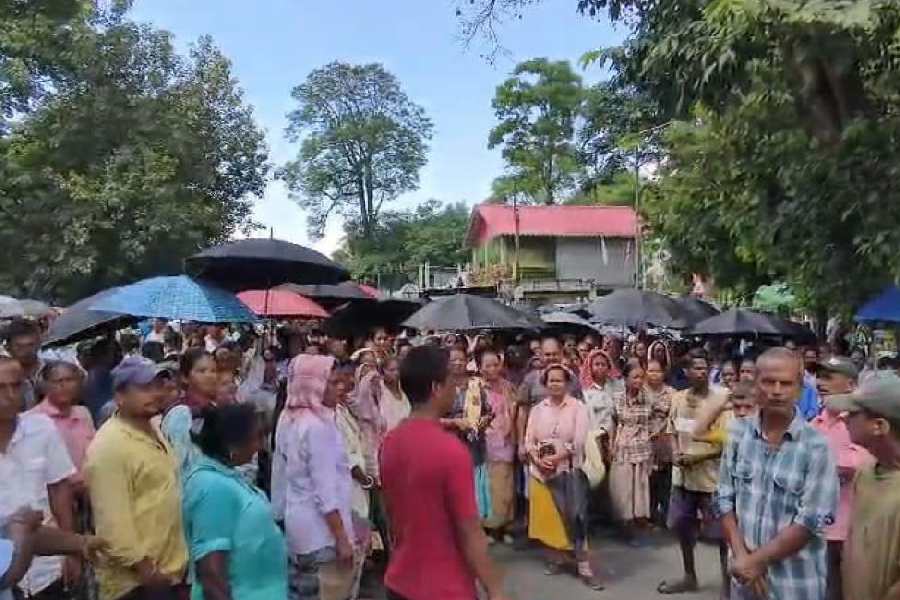 Workers of the Bagrakote tea estate stage a blockade on NH17 along the Sevoke-Malbazar stretch of Jalpaiguri on Wednesday over bonus.