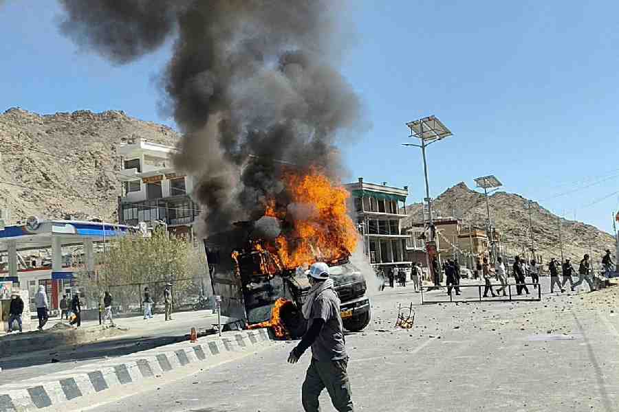 A vehicle is set on fire during a protest by locals demanding statehood for the federal territory and job quotas for local residents in Leh, in the Ladakh region, India, September 24, 2025.