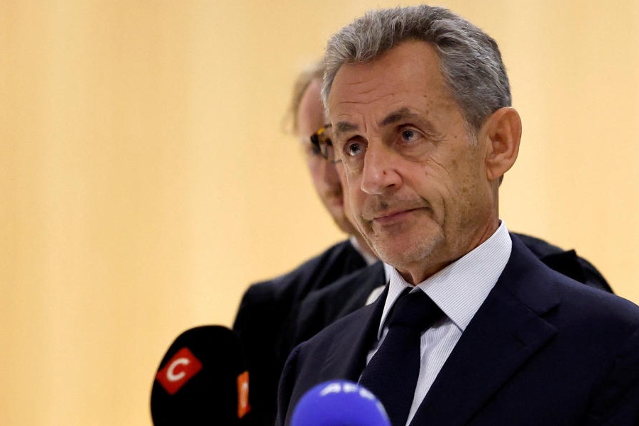 Former French President Nicolas Sarkozy talks to journalists after the verdict in his trial with other defendants on charges of corruption and illegal financing of an election campaign related to alleged Libyan funding of his successful 2007 presidential bid, at the courthouse in Paris, France, September 25, 2025.