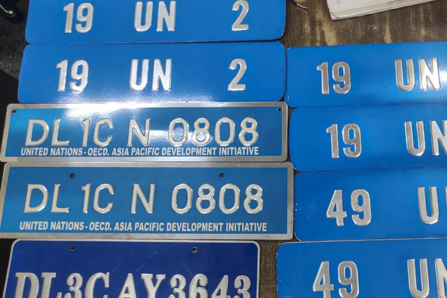 A view of nine diplomatic plates found after investigation in the Swami Chaitanyananda Saraswati's case, in New Delhi, Wednesday, Sept. 24, 2025.