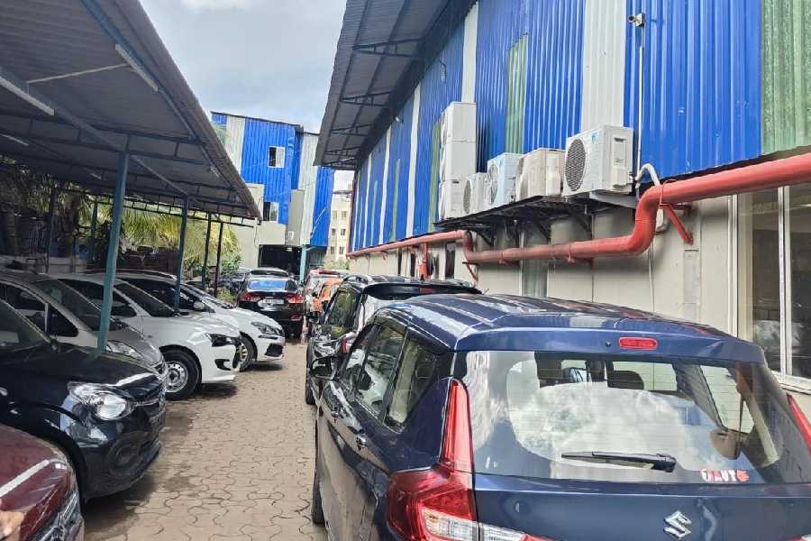 Damaged cars at a workshop in Kalikapur on Friday