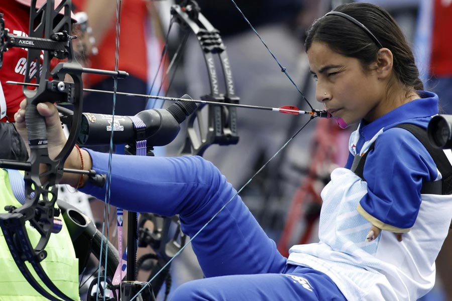 Devi from India prepares to fire during the Paralympic Games in Paris on Thursday, Aug. 29, 2024.