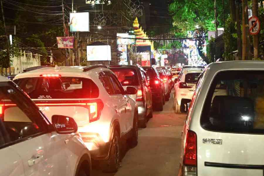 Traffic jam due to a performance is going on in a Durga Puja opposite Shakespear Sarani Police Station on Saturday evening