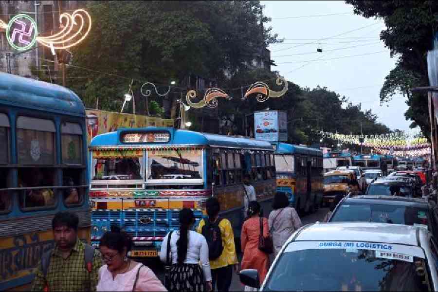 Traffic slowed down on Bhupen Bose Avenue as pandal hoppers crowded the streets– Picture by Sanat Kr Sinha.