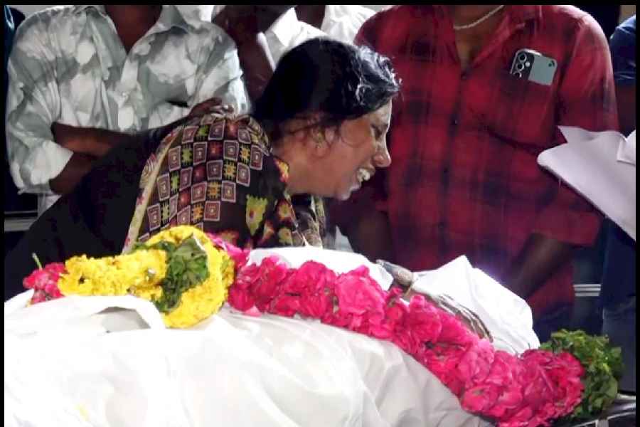 A bereaved family member of one of the victims, who died after a stampede at actor-politician Vijay's rally on Saturday, mourns outside the mortuary at the Government Hospital, in Karur district, Tamil Nadu, Sunday, Sept. 28, 2025. The toll from the stampede has risen to 38, Tamil Nadu DGP G Venkataraman said.